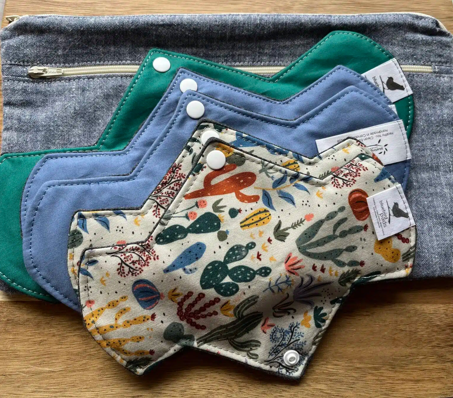 An assortment of feminine pads and Protectors with different designs and colors